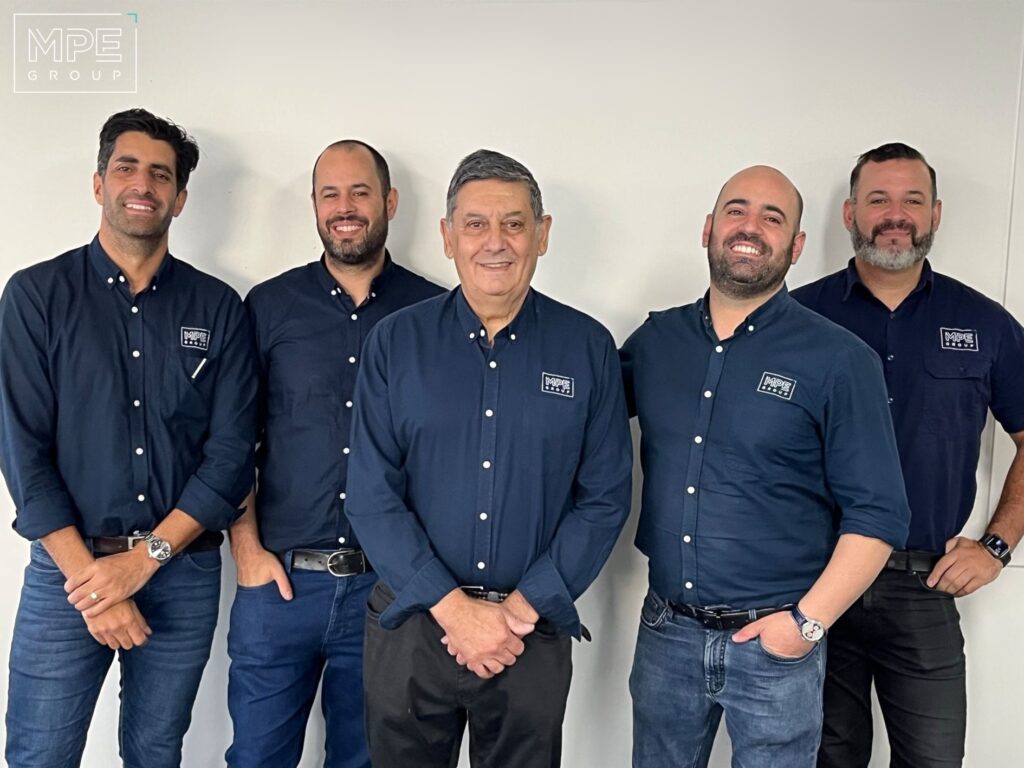 Photo of panel of speakers from MPE Group - Founder Bernie Olanda, GM Francis Mezzatesta, and Bernie’s three sons (Directors)
